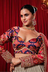 Cream and Gold Tissue Lehenga with Patola Choli and Rust Red Embroidered Dupatta