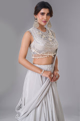 Ivory White Pre-Draped Lehenga featuring heavily Embroidered Pearl Fringe Blouse with Attached Dupatta
