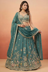 Deep Rama Tissue Lehenga Choli with Scenic Peacock & Animal Motif Embroidery