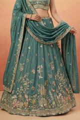 Deep Rama Tissue Lehenga Choli with Scenic Peacock & Animal Motif Embroidery