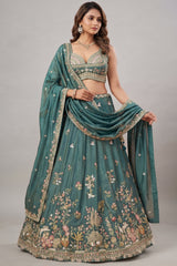 Deep Rama Tissue Lehenga Choli with Scenic Peacock & Animal Motif Embroidery
