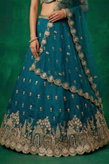 Teal Blue Tissue Lehenga Choli with Scalloped Jharokha and Peacock Embroidery
