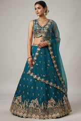 Teal Blue Tissue Lehenga Choli with Scalloped Jharokha and Peacock Embroidery