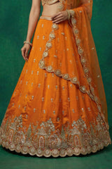 Orange Tissue Lehenga Choli with Scalloped Jharokha and Peacock Embroidery
