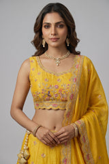 Bright Yellow Tissue Lehenga Choli with Elephant and Peacock Heritage Embroidery