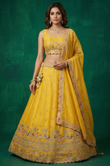 Bright Yellow Tissue Lehenga Choli with Elephant and Peacock Heritage Embroidery