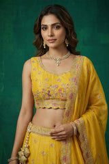 Bright Yellow Tissue Lehenga Choli with Elephant and Peacock Heritage Embroidery