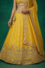 Bright Yellow Tissue Lehenga Choli with Elephant and Peacock Heritage Embroidery
