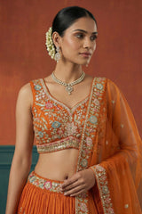 Orange Pleated Georgette Lehenga Choli with Embroidered Hem