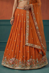 Orange Pleated Georgette Lehenga Choli with Embroidered Hem