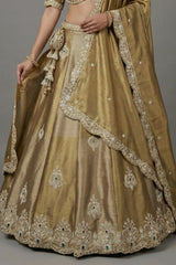 Antique Gold Tissue Lehenga Choli with Scalloped Medallion Embroidery