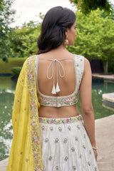 Off White Lehenga Choli with Floral Embroidered Border