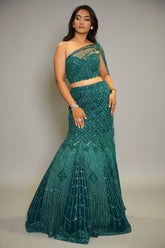 Teal Blue Net Embellishment Fish Cut Sequin Cutdana Work Lehenga with One Shoulder Cape Corset