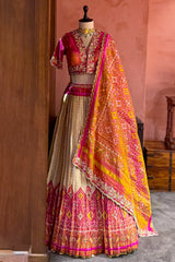 Cream and Fuchsia Two-Tone Tissue Silk Pleated Patola Ikkat Lehenga with Hand-Embellished Zardosi V-Neck Blouse