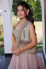 Muted Mauve Tissue Asymmetric Layered Lehenga Set With Heavily Embroidered Fusion Jacket