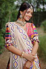 The Rajwadi Patola Silk Lehenga Ensemble With Scalloped V-Neck Hand-Embellished Blouse And Sheer Organza Tissue Dupatta