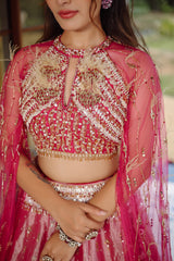 The Fuchsia Pink Ombre Tissue Lehenga Ensemble with High-Neck Keyhole Blouse and Floor-Length Feather Cape Sleeves