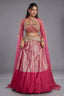 The Fuchsia Pink Ombre Tissue Lehenga Ensemble with High-Neck Keyhole Blouse and Floor-Length Feather Cape Sleeves