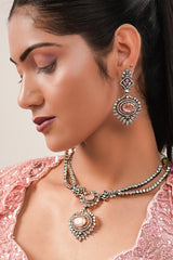 Blossom Pink Net Lehenga featuring Hand-Embellished V-Neck Blouse with Hanging Beads
