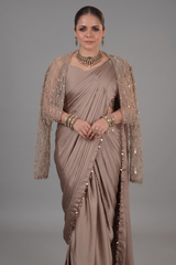 Taupe Satin Silk Pre Stitched Saree Featuring with a Narrow Embellished and Cutdana Short Cape Jacket