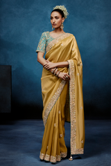 Mustard Gold Saree With Contrasting Turquoise Blue Embroidered Blouse In Cutdana Work
