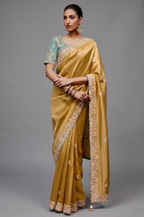 Mustard Gold Saree With Contrasting Turquoise Blue Embroidered Blouse In Cutdana Work