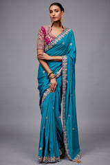 Teal Blue Saree with Magenta Contrasting Embroidered Blouse