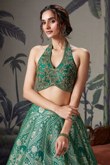 Green Banarasi Brocade Silk Zari Woven Lehenga with Zardosi Work Halter Neck Blouse
