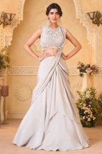 Ivory White Pre-Draped Lehenga featuring heavily Embroidered Pearl Fringe Blouse with Attached Dupatta