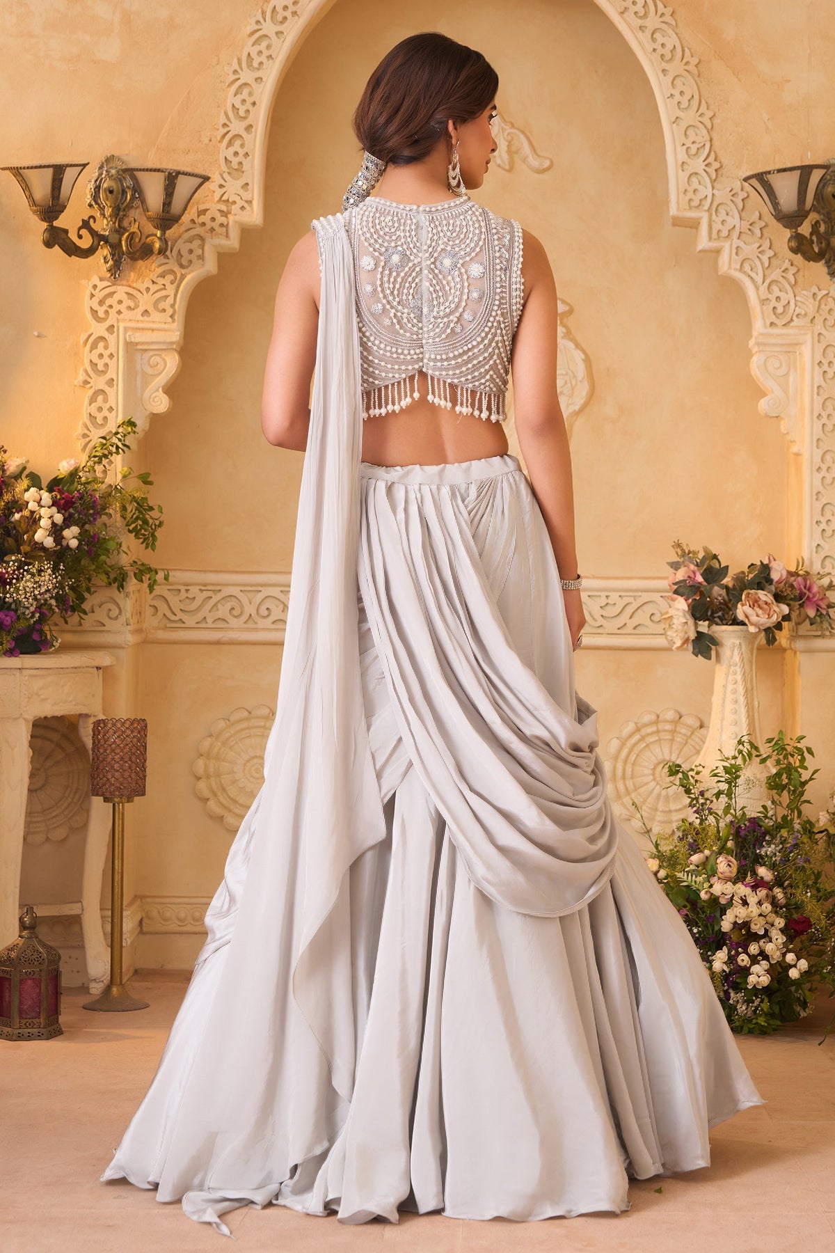 Ivory White Pre-Draped Lehenga featuring heavily Embroidered Pearl Fringe Blouse with Attached Dupatta