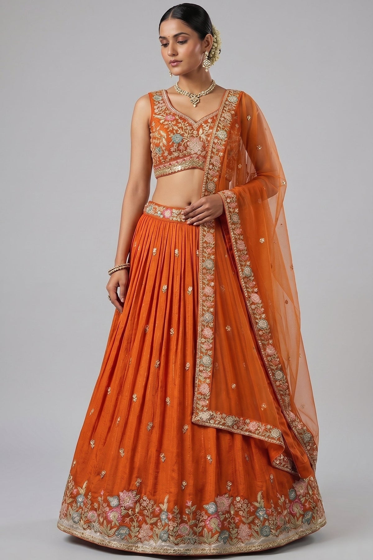 Orange Pleated Georgette Lehenga Choli with Embroidered Hem