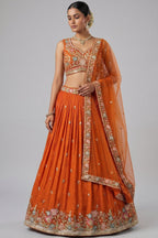 Orange Pleated Georgette Lehenga Choli with Embroidered Hem