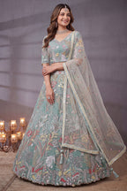 Ice Sky Blue Soft Net Lehenga Choli highlighted with Multi-Color Botanical Embroidery