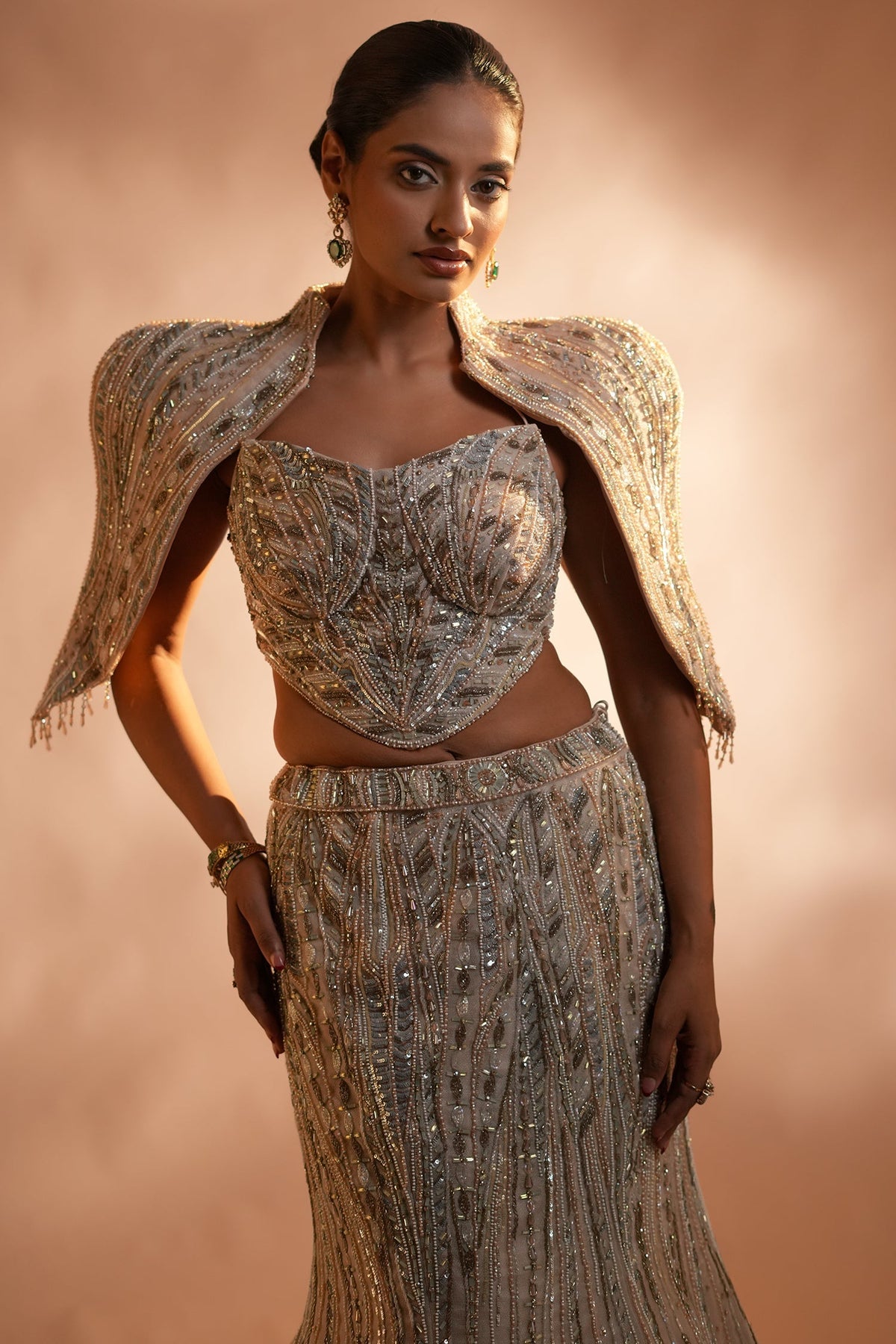 Blush Pink Net Mermaid Lehenga Set with Structured Corset Blouse and Embellished Shoulder Cape