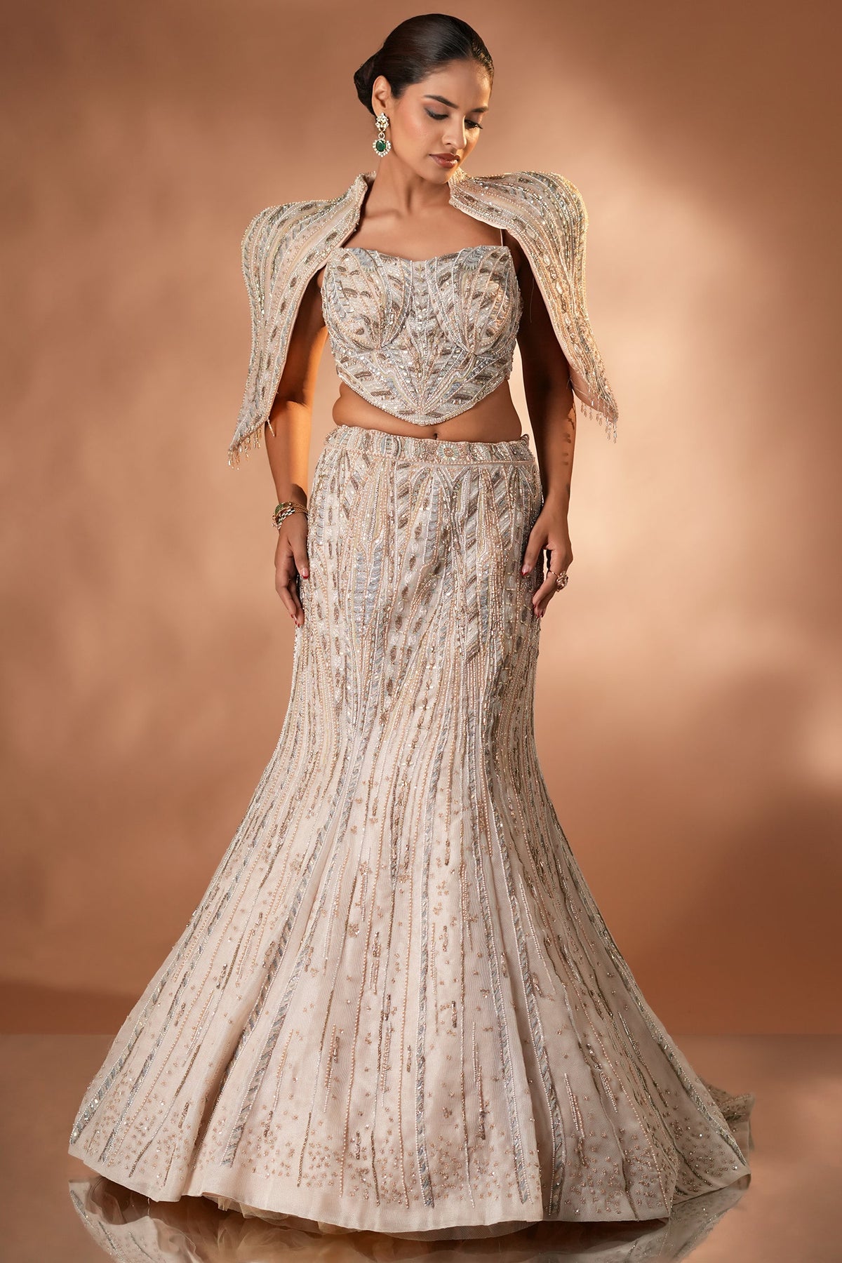 Blush Pink Net Mermaid Lehenga Set with Structured Corset Blouse and Embellished Shoulder Cape