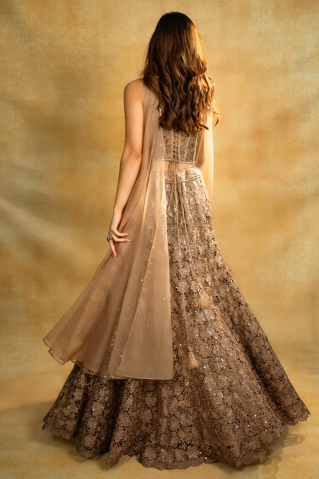 Rose Gold Net Sequinned Fish Cut Lehenga with Corset Blouse