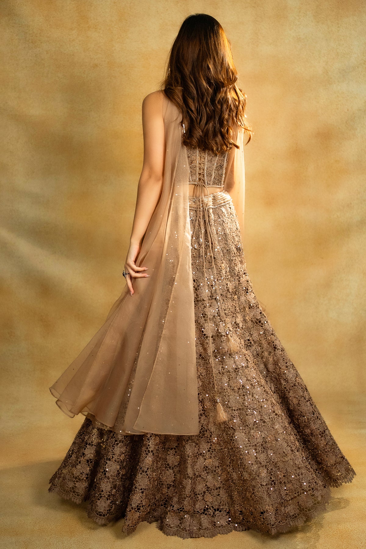 Rose Gold Net Sequinned Fish Cut Lehenga with Corset Blouse