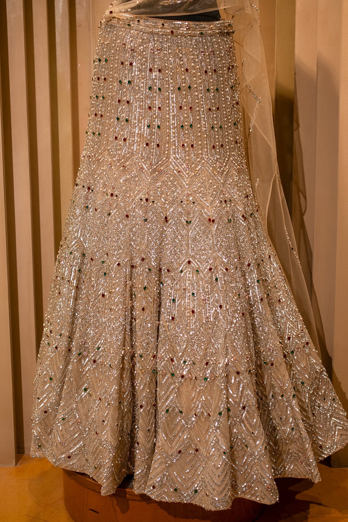 Champagne Gold Net Mermaid Lehenga with Attached Cape-Style Dupatta & Intricate Cutdana Work