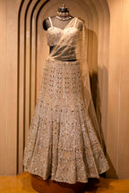 Champagne Gold Net Mermaid Lehenga with Attached Cape-Style Dupatta & Intricate Cutdana Work