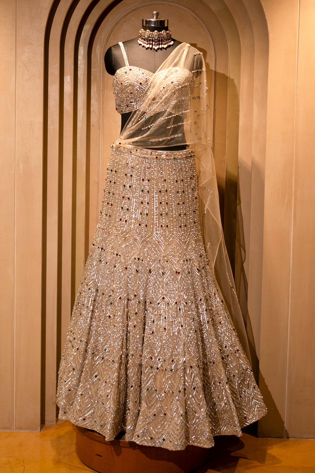 Champagne Gold Net Mermaid Lehenga with Attached Cape-Style Dupatta & Intricate Cutdana Work