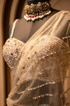 Champagne Gold Net Mermaid Lehenga with Attached Cape-Style Dupatta & Intricate Cutdana Work