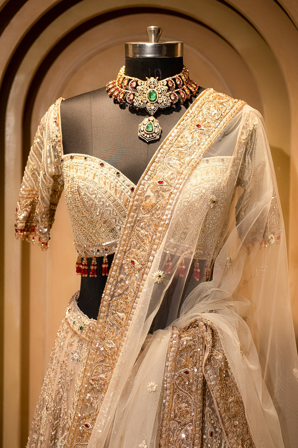 Royal Beige Net Bridal Lehenga with Luminescent Stone-Craft and Ethereal White Veil