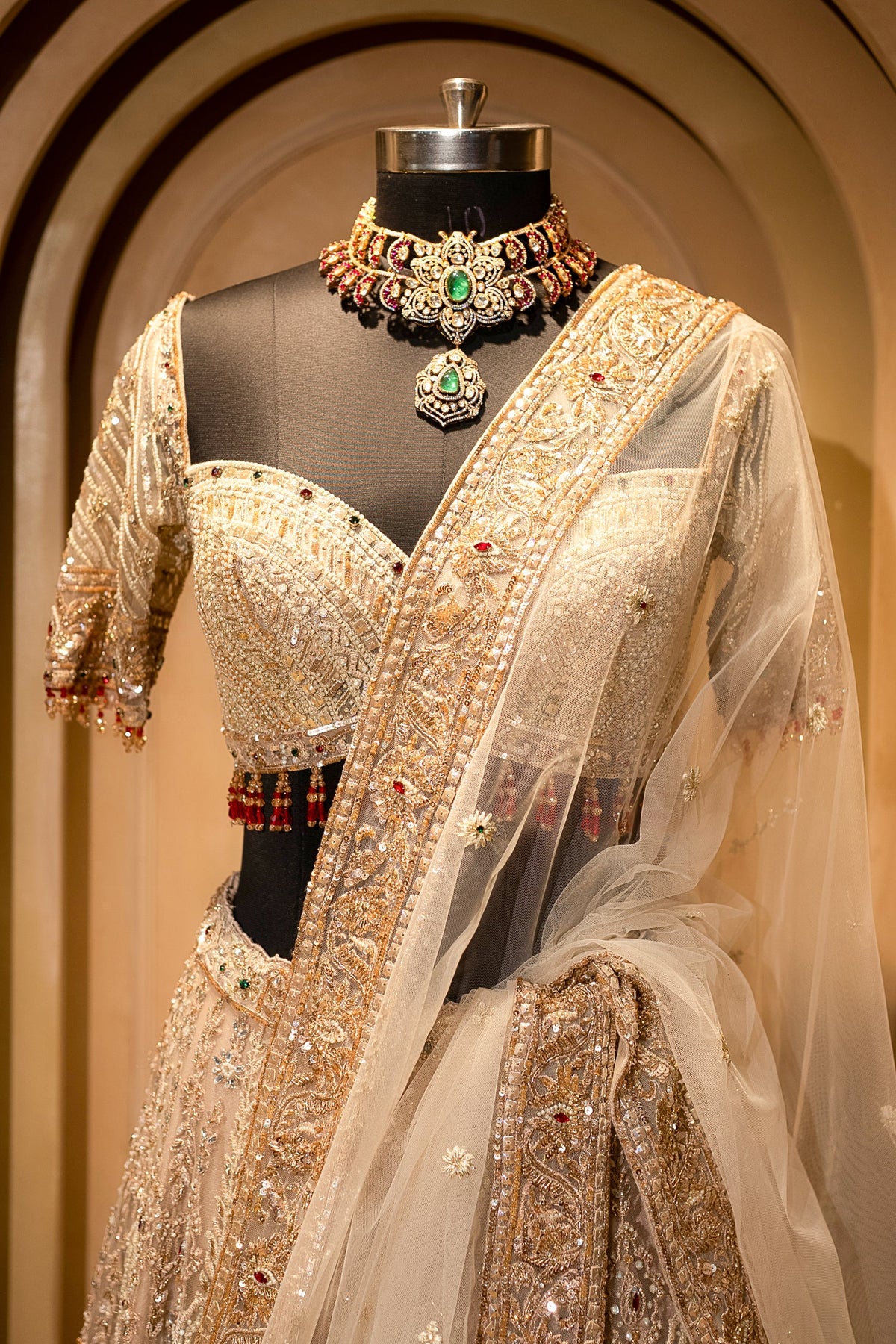 Royal Beige Net Bridal Lehenga with Luminescent Stone-Craft and Ethereal White Veil