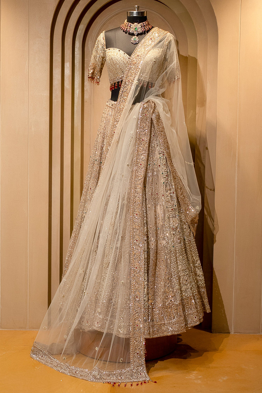 Royal Beige Net Bridal Lehenga with Luminescent Stone-Craft and Ethereal White Veil
