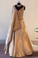 Golden Tissue Silk Lehenga with Kundan Worked Corset