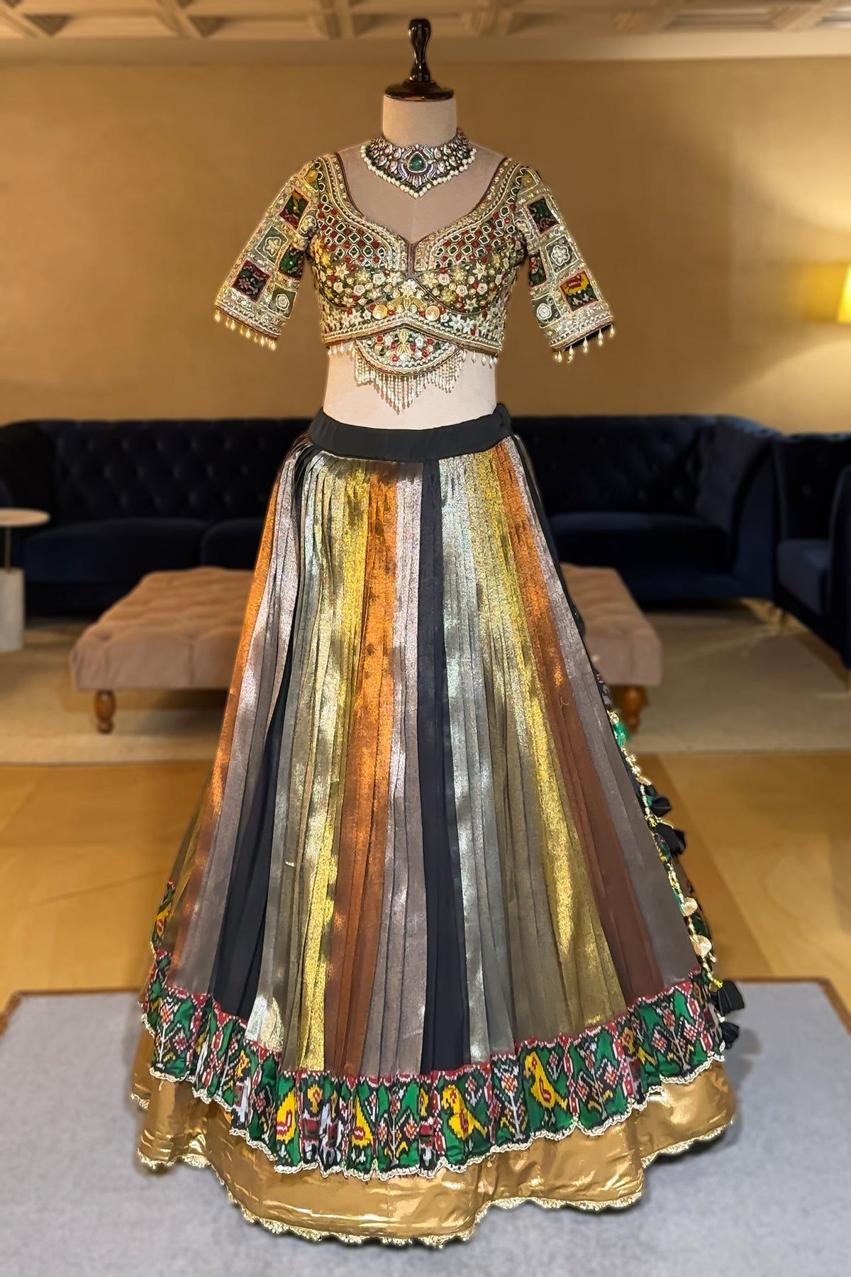 Sage Green Metallic Tissue Accordion Pleated Lehenga with Heritage Patola Weaving & Mirror-Work Blouse