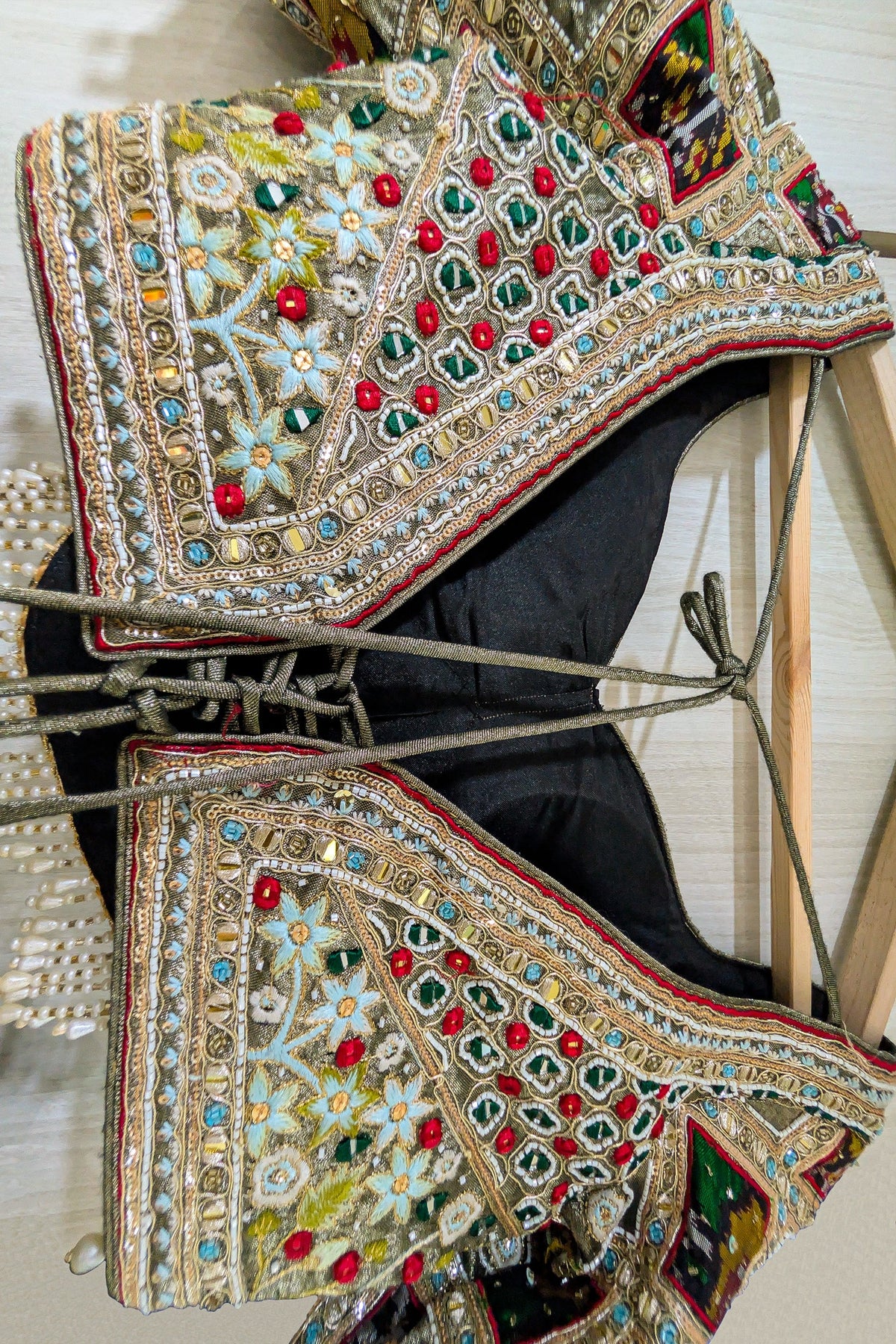 Sage Green Metallic Tissue Accordion Pleated Lehenga with Heritage Patola Weaving & Mirror-Work Blouse