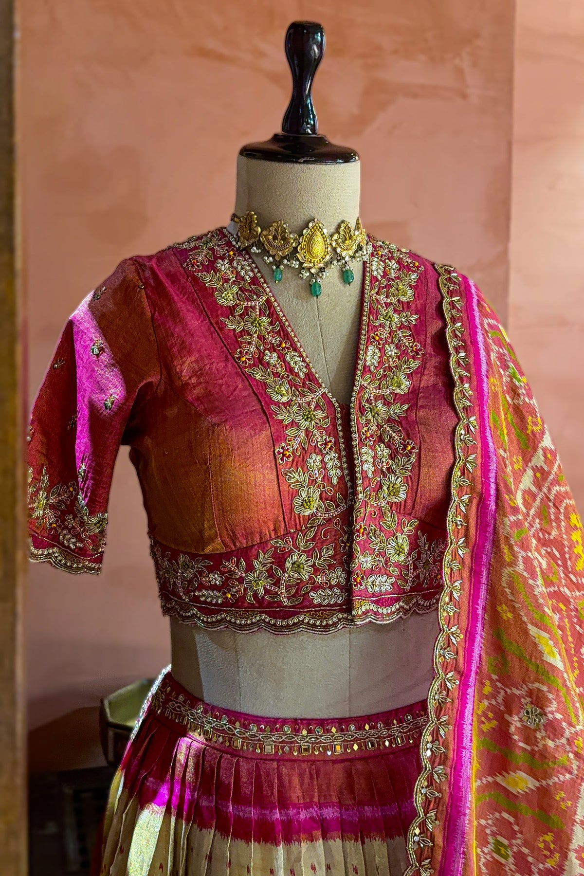 Cream and Fuchsia Two-Tone Tissue Silk Pleated Patola Ikkat Lehenga with Hand-Embellished Zardosi V-Neck Blouse