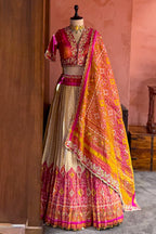 Cream and Fuchsia Two-Tone Tissue Silk Pleated Patola Ikkat Lehenga with Hand-Embellished Zardosi V-Neck Blouse