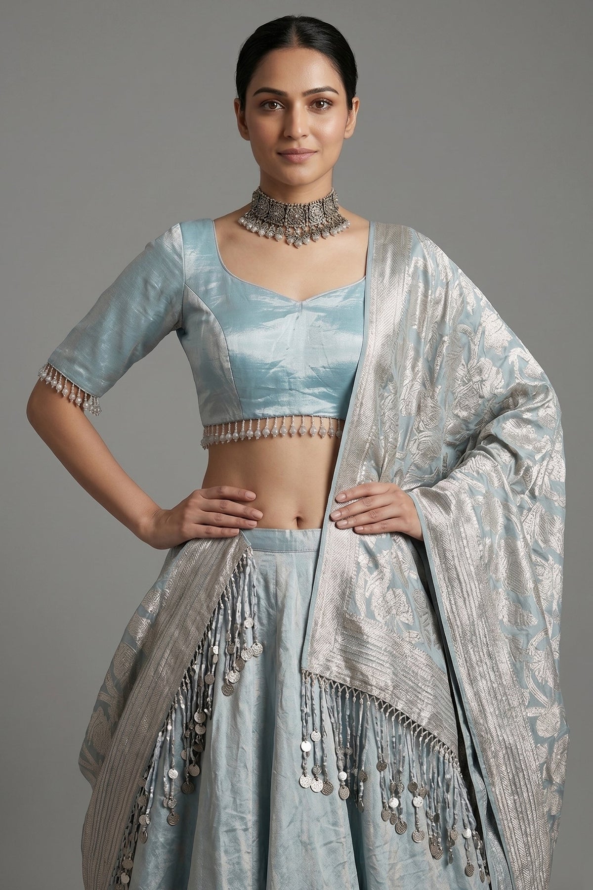 Icy Blue Metallic Tissue Silk Minimalist Lehenga Choli with Woven Banarasi Dupatta and Cowrie Shell Tassels